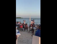 Family photo shoot at beach seaside restaurant