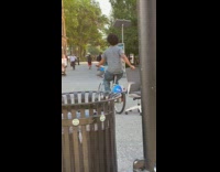 Man rides bike and drags office chair