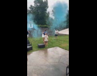 Man shoot popper towards friend gender reveal