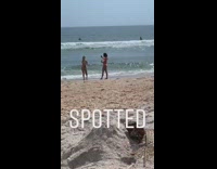 two girls bikini pose on beach spotted