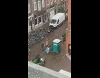 Woman brown coat red bonnet flip hair snow