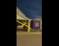 Guy throws toy paper yellow airplane and it hits filmer 