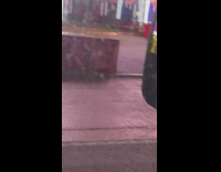 Guy in white mask stares at reflection 