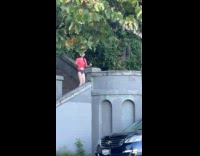Woman red top tiktok dance at stairs