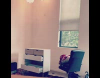 Guy smashes white dresser with black kettlebell 