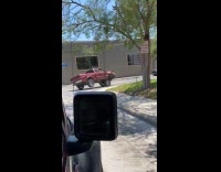 Rundown truck with sideway wheels stuck on street