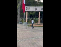 Man in overalls tiktok dance at street
