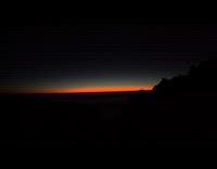 Time lapse sunrise on mountain over clouds