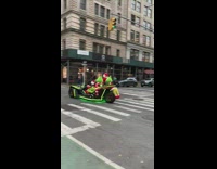 Person in Grinch Costume Waves to People 