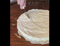 Center of new cheesecake is cut out 