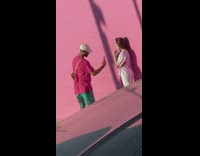 Woman face mask photo shoot pink wall