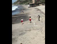 Couple red shorts run frolic on beach