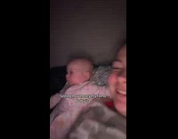 Baby looks at phone pranked by mom