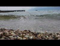 Slow motion video of beach waves of Lake Garda