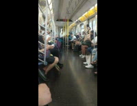 Guy sits on motorcycle on train 