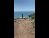 Girl headstand cliff ocean yoga