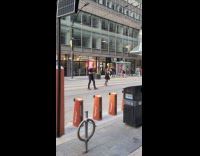 Collab IITW - Woman black dress walks middle of street