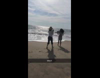 Brunette woman violin beach