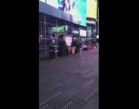 Woman black dress ballerina spin Times Square