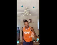 Guy orange NASA shirt dances to hip hop song with emojis