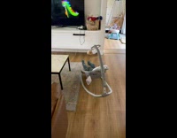 Baby is chair kicks in the air