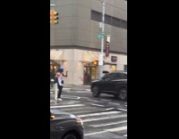 Man with helmet ask alms with long stick