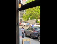 Man balances tv on head at bike