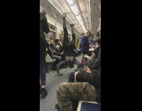 Two guys wearing spiderman costumes dance subway 