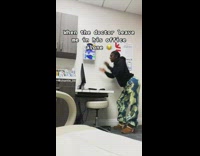 Girl in black hoodie looking around doctors office