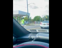 Guy blows bubbles on street 
