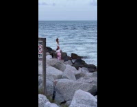 Collab IITW - Woman vest top dances on beach rocks