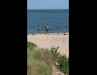 Two men shirtless muscle beach photo shoot