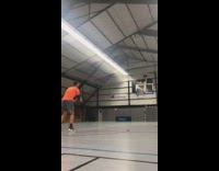 Guy shoots half court free throw 