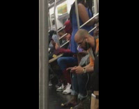 Spiderman plays bongo drums and sings on subway train