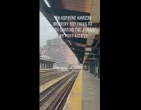 Person sitting atop the J train as it is departing the station 

