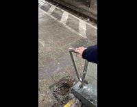 Person push ice formed on stainless railings