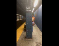 Collab Subway Creatures - Person Chucky costume peeks from train post