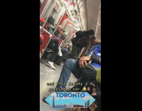 Woman lifts up shirt and dances on the floor on subway train