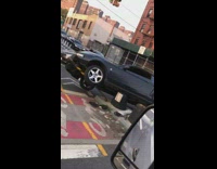 Black car seen on top of street platform  