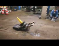 Yellow traffic cone shoots flies out guy