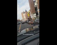 Brown convertible car with yellow tire boot 