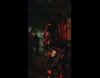 Tall Man in Mechanical Armor Poses for Picture