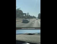 Collab Kook Of The Day - red surfboard in silver car on freeway