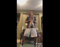 Red hat guy dances with baby deer