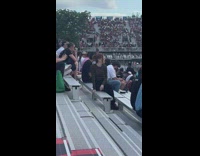 Girl sit pose look at race track 