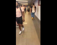 Man creepy doll tied on bag subway