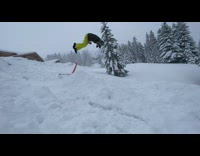Guy rides scooter sled and frontflips off ramp, falls into snow slow motion