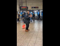 Man dancing watch woman singing Taylor song