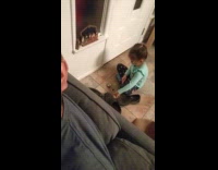 Girl plays on floor slice baby Jesus