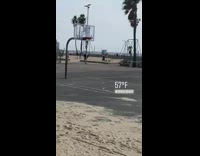 Girl on railings play with ball beach